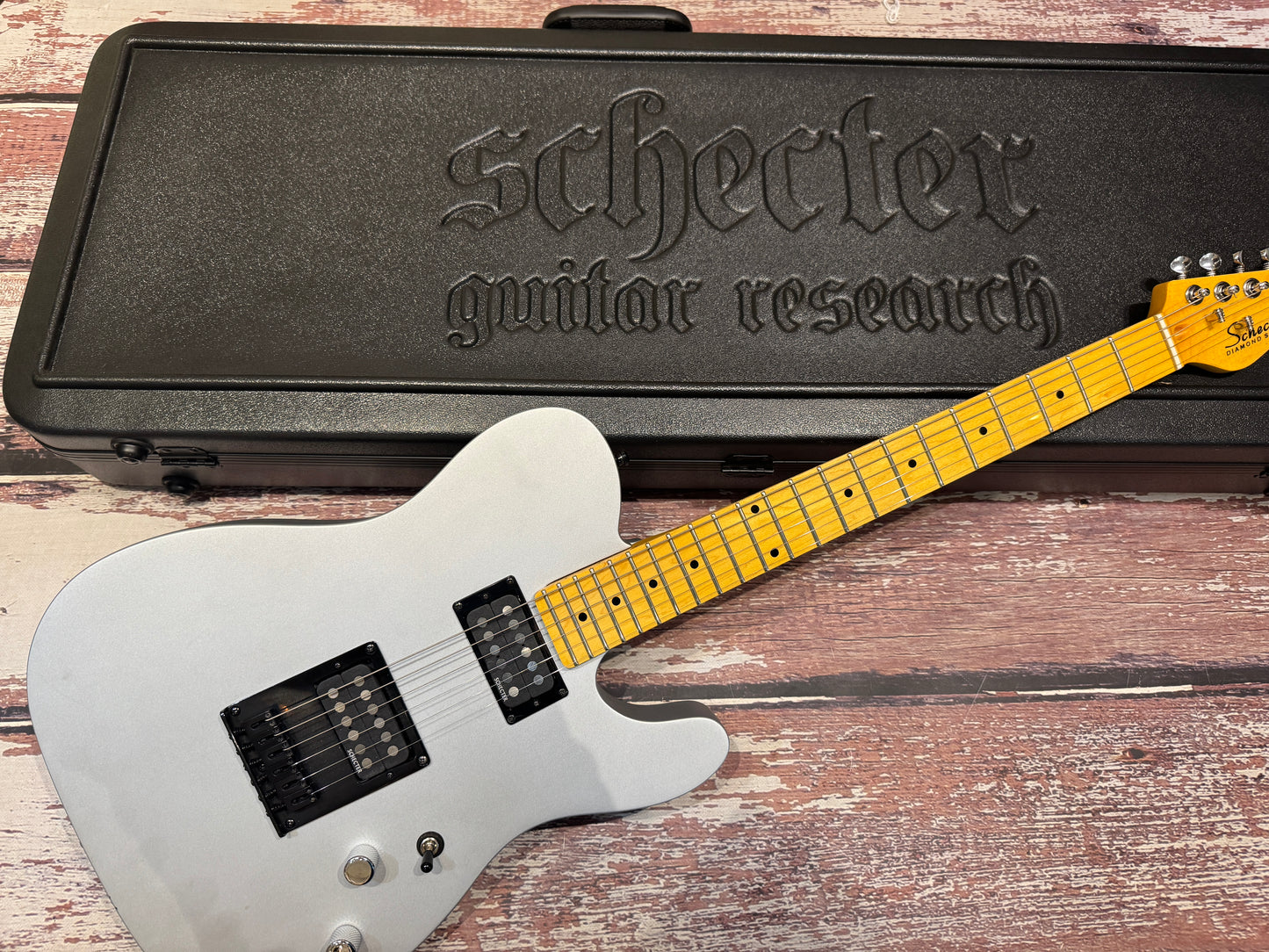 Schecter Diamond Series PT "Black", custom finish with Schecter hard case.